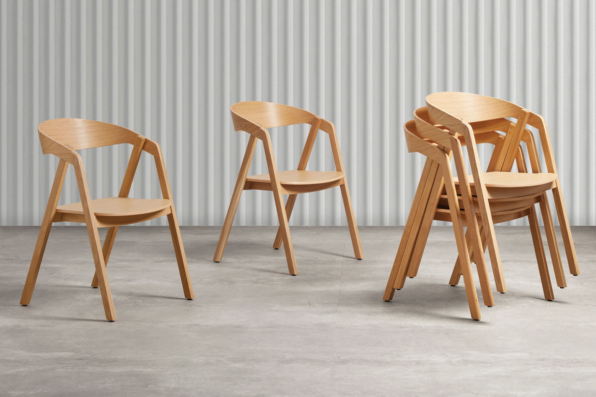 Wooden commercial chairs showing stackable seating options Wooden commercial chairs showing stackable seating options