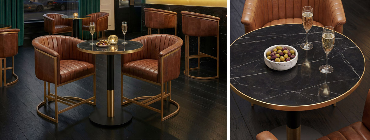 Tan leather upholstered armchairs and marble effect tables in a cocktail bar
